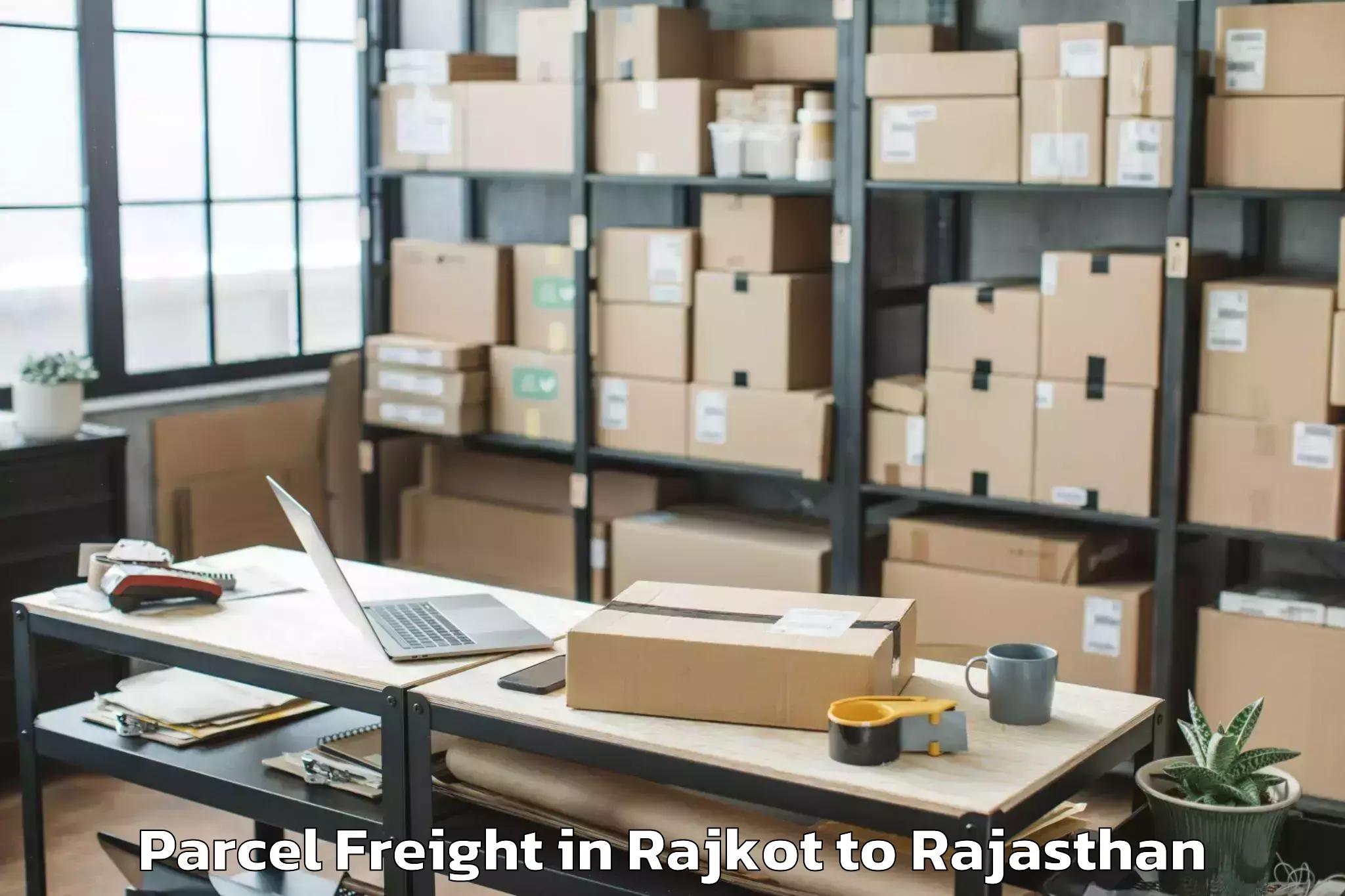 Leading Rajkot to Madanganj Kishangarh Parcel Freight Provider